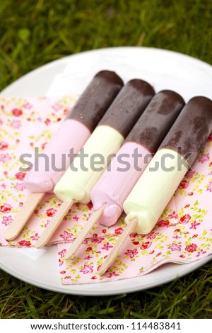 Close-up of delicious ice-cream sticks with chocolate coating