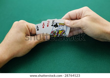 Ace Ace Two King Double Suited. Premium starting hand in Omaha High Low poker.