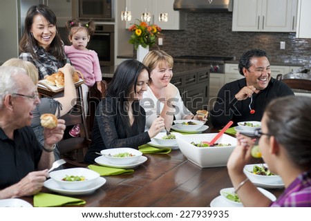 a family dinner / the family interaction / that is happening