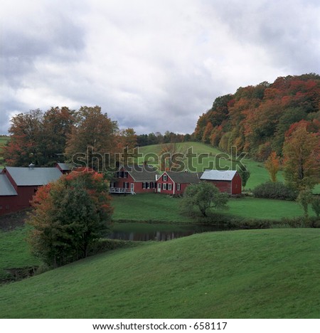 New England farm scene with fall colors starting.
