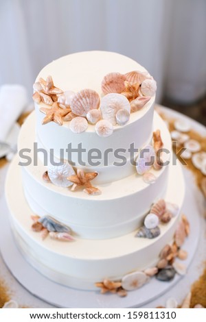 White Wedding Cake with Beach Decor