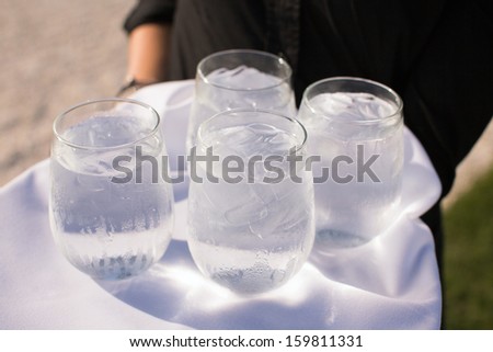 Ice Water Being Served by a Caterer