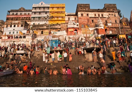 VARANASI, INDIA - FEBRUARY 20: Hindu pilgrims take holy bath in the river ganges on the auspicious Maha Shivaratri festival on February 20, 2012 at Dasashwamedh ghat in Varanasi, Uttar Pradesh, India