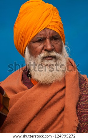 SHANTINIKETAN, INDIA - DECEMBER 23: An unidentified  elderly baul folk singer attends the annual Poush Mela fair on December 23, 2012 in Shantiniketan, West Bengal, India.
