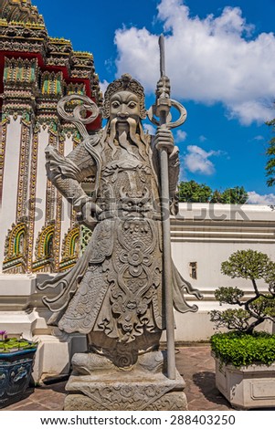 Statue of an ancient chinese warrior outside a temple in Bangkok, Thailand