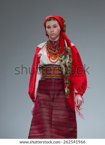 KIEV, UKRAINE - MARCH, 21, 2015: Models on the catwalk wears an authentic Ukrainian national costumes on the fourth day of the Ukrainian Fashion Week. This show is part of 