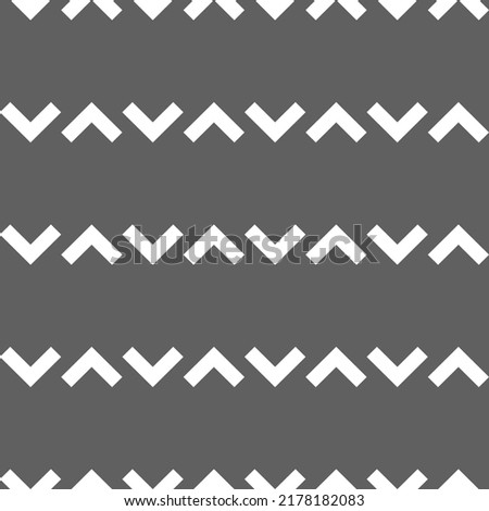 Vector. Grey and white abstract ethnic seamless pattern. Background of angle brackets. Mosaic. Design of packaging paper, textile printing, web design, cover, advertising and typographic products.