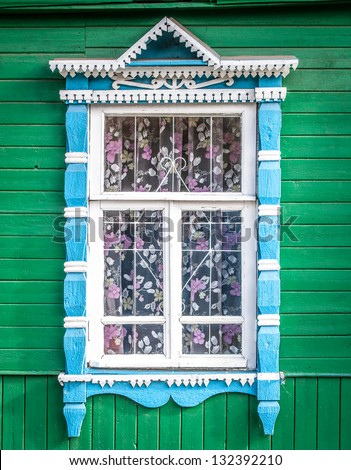 Window of old traditional russian wooden house. Kostroma, golden ring, Russia.