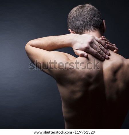 Pain neck. The back man.Black background