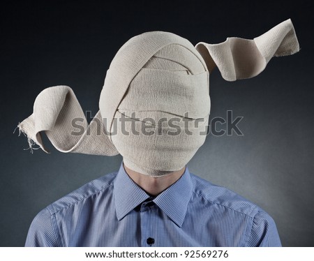 Portrait of the man with elastic bandage on a head