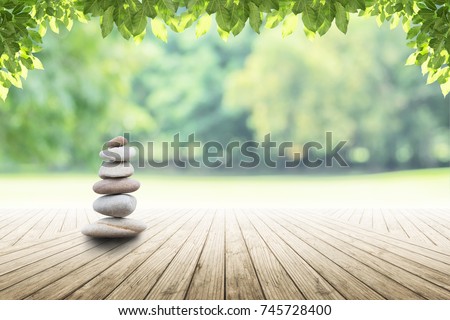 zen stones on empty wooden with green leaf in the garden background blurred and . Concept relaxation, zen, spring.  Stok fotoğraf © 