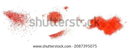 Scatters of red pepper powder. Vector realistic illustration of ground paprika and chili pepper seasoning. Splashes of hot dried spice isolated on white background