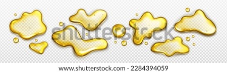 Realistic set of yellow liquid spills and blobs isolated on transparent background. Vector illustration of oil, fruit juice, honey, beer, fuel puddles and drops of abstract shape on surface top view