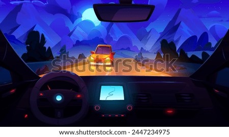 Night mountain view from inside car. Vector cartoon illustration of auto riding highway towards rocks, traffic on road illuminated by headlamps, steering wheel, gps navigator on dashboard, moon in sky