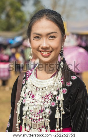DOI MUSER, TAK PROVINCE, THAILAND FEBUARY  8, 2015 : Unidentified Hmong hill tribe woman in traditional clothes poses and looks at camera in \