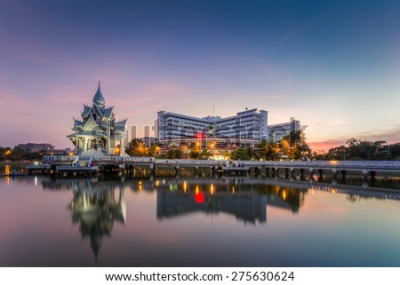 Pitsanulok-Thailand - May 6 2015: Building reflection of Naresuan University Hospital at Twilight time. This hospital locate in Pitsanulok, Thailand.