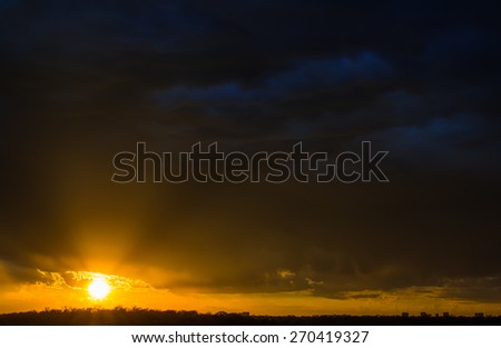 Stormy sunset with rolling clouds