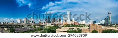Panorama of the Dallas Texas Skyline on a partly cloudy day.