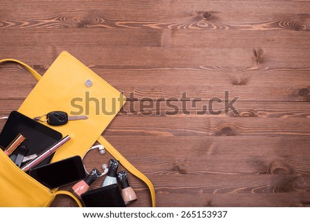 handbags. everyday woman\'s things. desktop dark wood