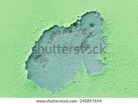 Green wall damage with peeling paint background texture