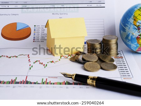 Close up of Money coins stack and House paper for Loans money concept