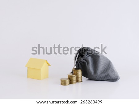 Coins stack and money bag with house paper for Home Loans concept