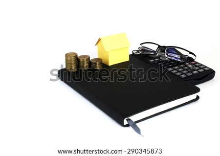 Mortgage loans concept with coins stack and house paper on book