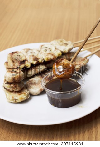 Close up of grilled banana with thai caramel sauce to eat