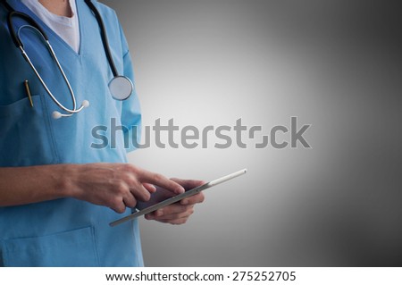 Healthcare And Medicine. Doctor using a digital tablet