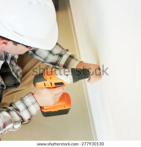 man  with electric drill