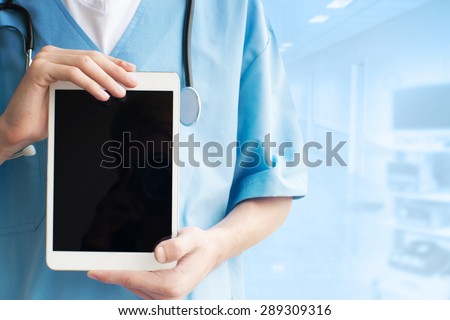 Doctor working with tablet computer
