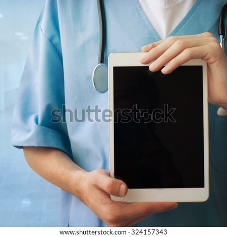 Healthcare And Medicine. Doctor with tablet.