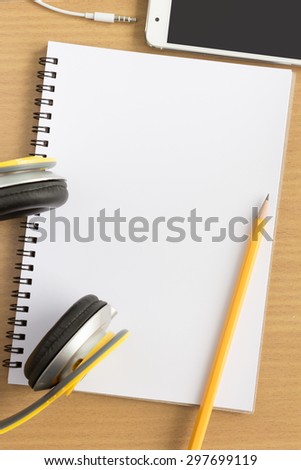 blank notebook in top view with music concept