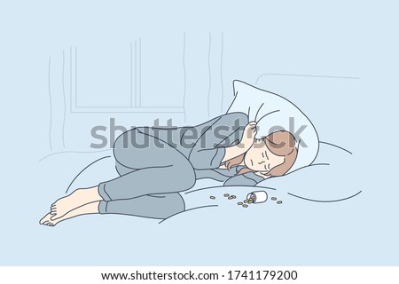 Depression, overdose, frustration, addiction concept. Depressed unhappy frustrated young woman lying on bed with opened bottle of pills. Suffering from insomnia or mental stress psychological problem.