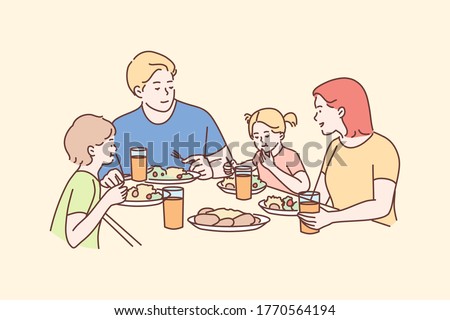 Family, meal, recreation, leisure, dinner, fatherhood, motherhood, childhood concept. Man dad woman mom children kids son daughter eating breakfast dinner lunch supper together. Fathers or mothers day