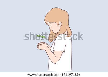 Sustainable lifestyle, ecological conversation, nature concept. Small smiling girl cartoon character standing and holding green plant with ground in hands in garden vector illustration 