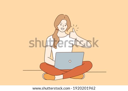 Freelance, Online distant work, internet technologies concept. Happy smiling woman cartoon character sitting on floor with legs crossed working on laptop computer and showing thumbs up sign