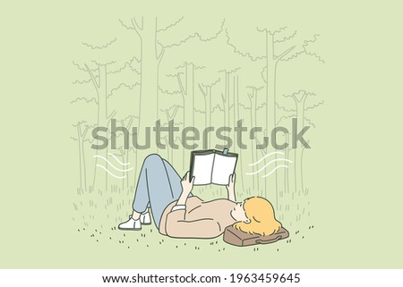 Relaxation, leisure and reading concept. Young happy woman cartoon character lying on grass in park reading book feeling relaxed vector illustration 