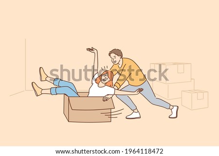 Having Fun during renovation in apartment concept. Happy young couple cartoon characters rolling in cardboard box during renovation and works or relocation vector illustration 