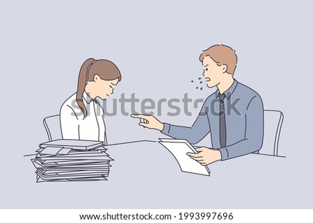Conflict at work and angry boss concept. Furious director businessman sitting and swearing at sad unhappy worker girl with heap of documents on table in office 