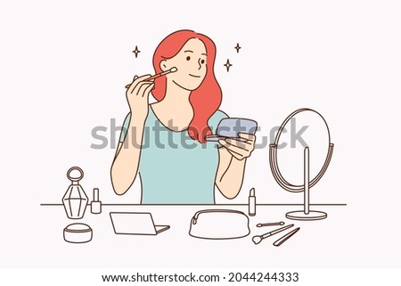 Beauty, skincare and makeup concept. Young pretty girl cartoon character sitting making makeup with brush looking at mirror vector illustration 