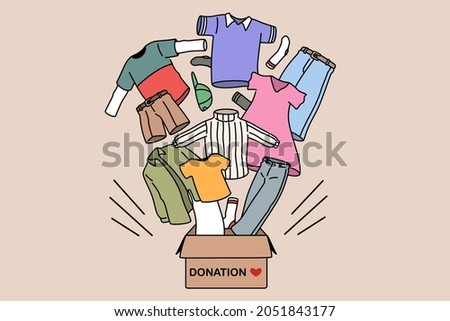 Charity and donating clothes concept. Box with donation word and carious human clothes flying from it for needing people vector illustration 