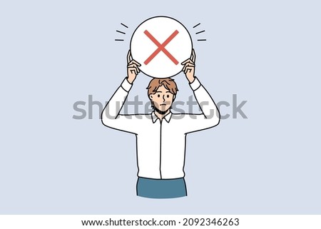 Stop and reject sign concept. Young frustrated serious man worker standing holding round red rejecting denying stop sign in hands vector illustration 