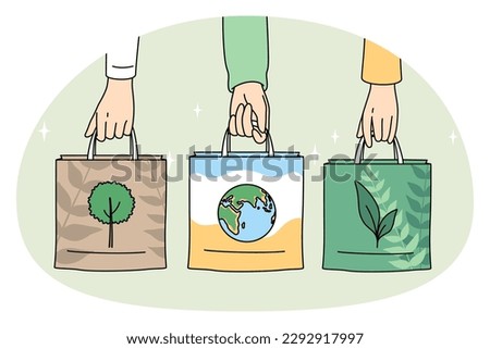Ecology care and eco-friendly things concept. Human hands holding eco-friendly bags with pictures of plant planet and tree vector illustration