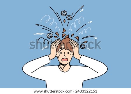 Psychological unbalanced man feels head explode due to excessive worries caused by stress. Overload of thoughts and mental pressure became reason for psychological breakdown or panic attack