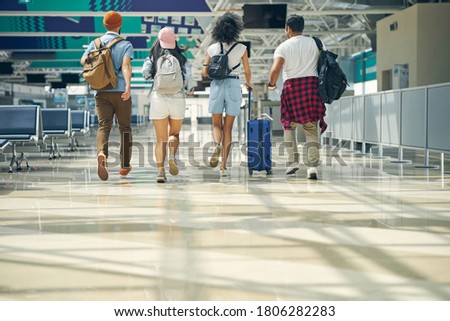 Similar – Image, Stock Photo Pleased tourist with backpack taking selfie on smartphone sitting on bridge above mountain river