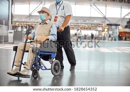 Similar – Image, Stock Photo Serious passengers in protective masks during their train trip