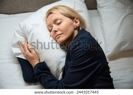 Similar – Image, Stock Photo Tired female traveler sleeping on airport.