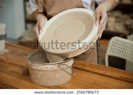 Similar – Image, Stock Photo Female ceramist making clay bowl in studio