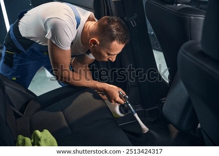 Similar – Image, Stock Photo Middle-aged man thoroughly cleans a tablet computer